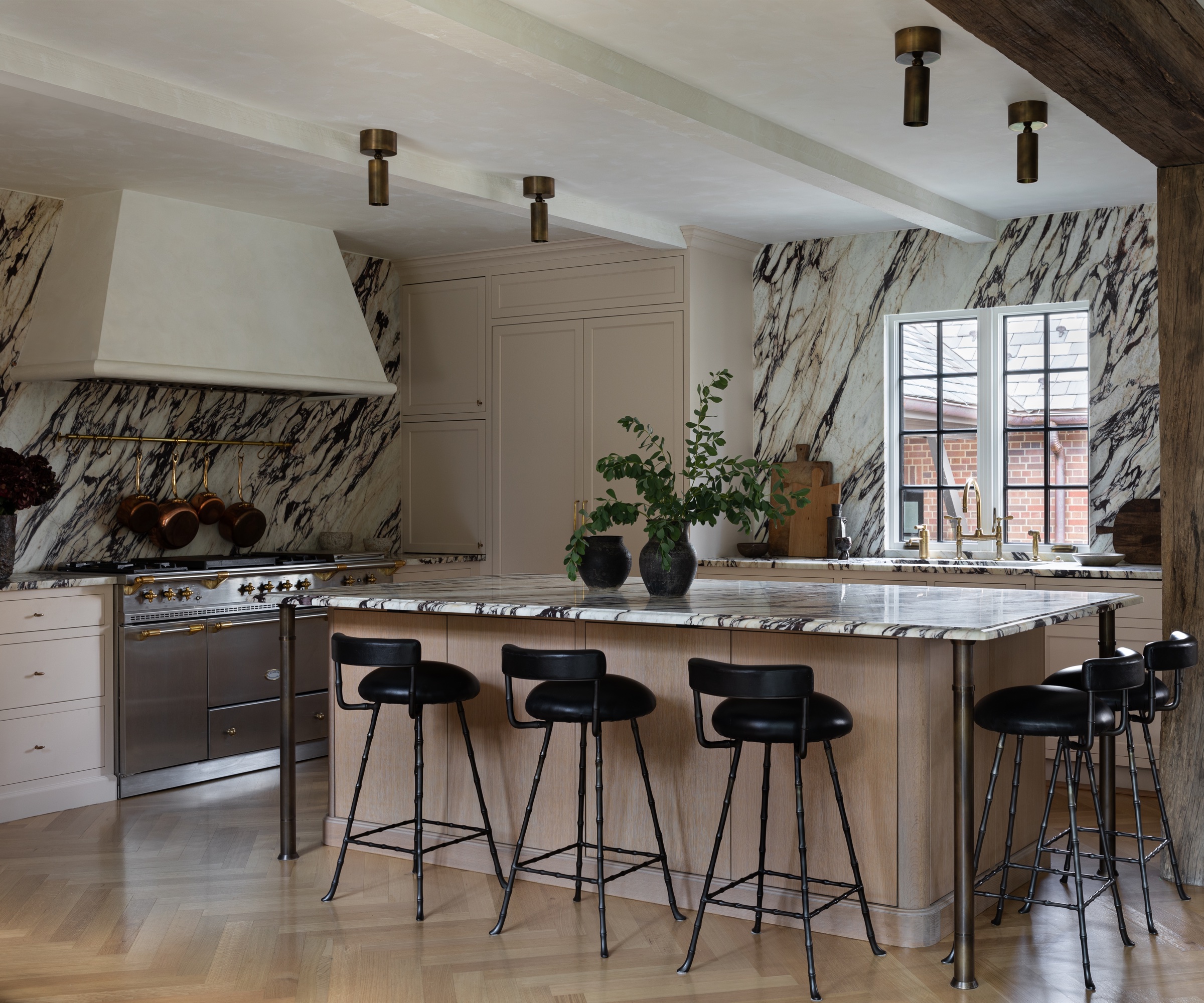 Marble kitchen with marble kitchen island and range cooker by Wendy Labrum Interiors