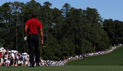 Tiger Woods walks down the fairway at Augusta National