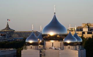 An aerial view of the dive onion shaped domes and further French landmarks are in the distance.