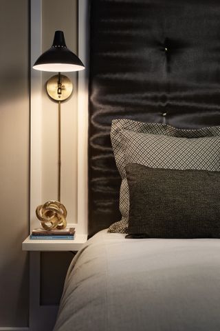 black and brass wall light in grey bedroom ideas for men, maestri studio