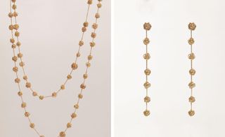 Gold necklace and matching drop earrings featuring gold chain and scribbled gold small spheres at intervals