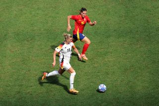 Alexandra Popp of Germany controls the ball against Laia Codina of Spain during the Women's Bronze Medal match between Spain and Germany during the Olympic Games Paris 2024 at Stade de Lyon on August 09, 2024 in Lyon, France.