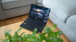 Asus ProArt PX13 laptop on a wooden surface