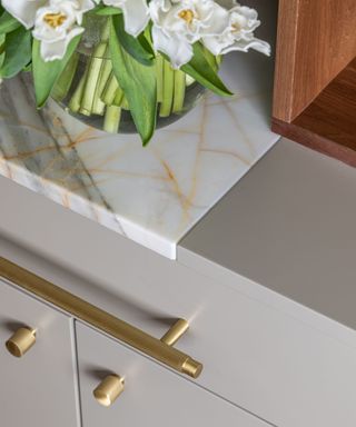 Marble and grey countertop, gold handles