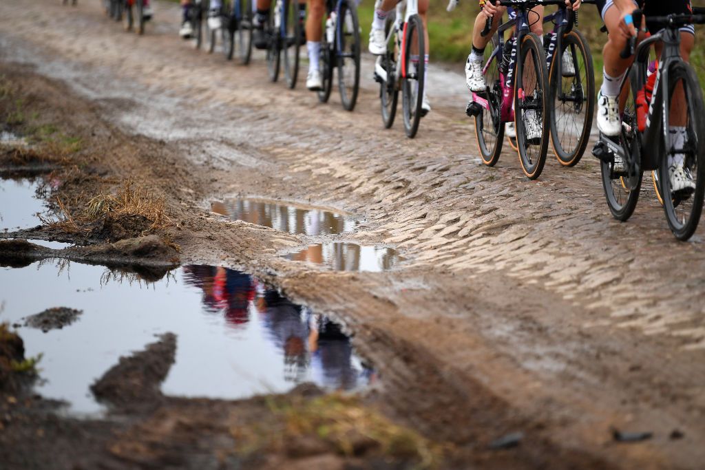 ROUBAIX FRANCE OCTOBER 02 Detailed view of the peloton compete through cobblestones sector during the 1st ParisRoubaix 2021 Womens Elite a 1164km race from Denain to Roubaix ParisRoubaixFemmes ParisRoubaix on October 02 2021 in Roubaix France Photo by Tim de WaeleGetty Images