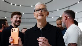 Tim Cook holding iPhone 17 Pro
