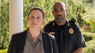 Det. Henry and Chief Carter standing at doorway in The Perfect Couple finale