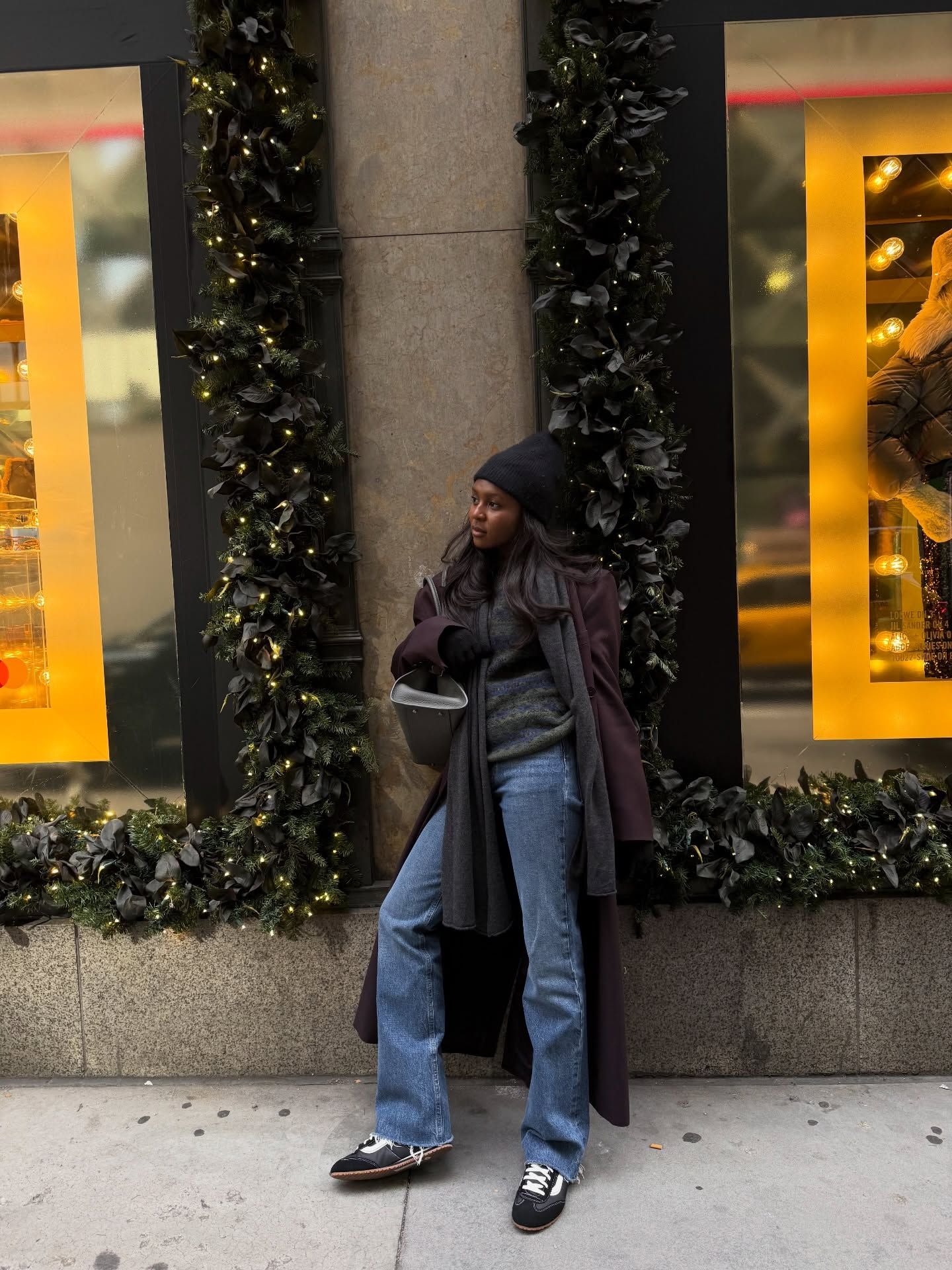 Woman wearing a sweatpant jeans outfit.