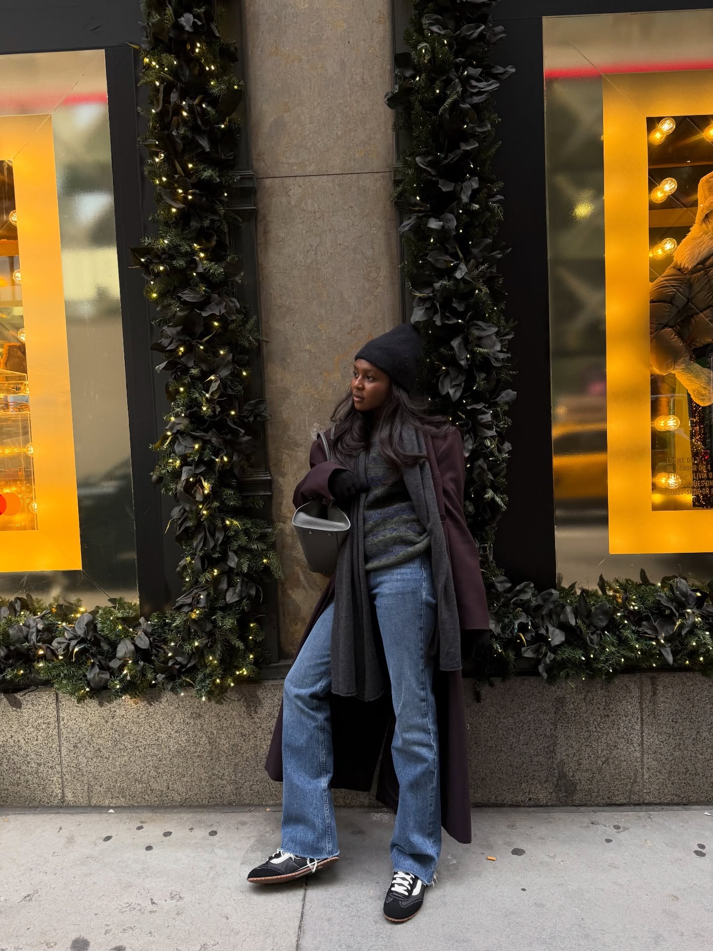 Woman wearing a sweatpant jeans outfit.