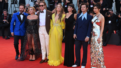 The cast of Don’t Worry Darling pose with director Olivia Wilde on the red carpet in Venice