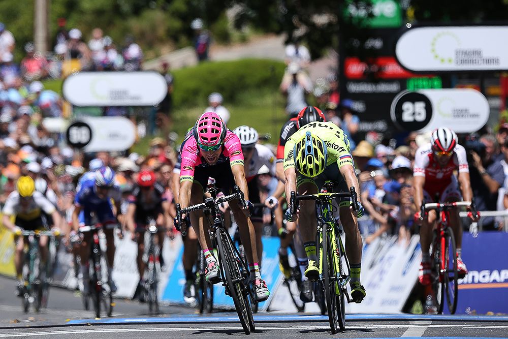 Jay McCarthy reaches for the stage 2 line ahead of Diego Ulissi.