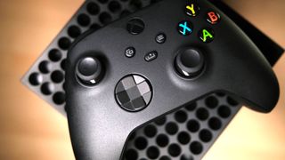 Xbox Streaming Stick - Xbox Series X controller on top of an Xbox Series X console