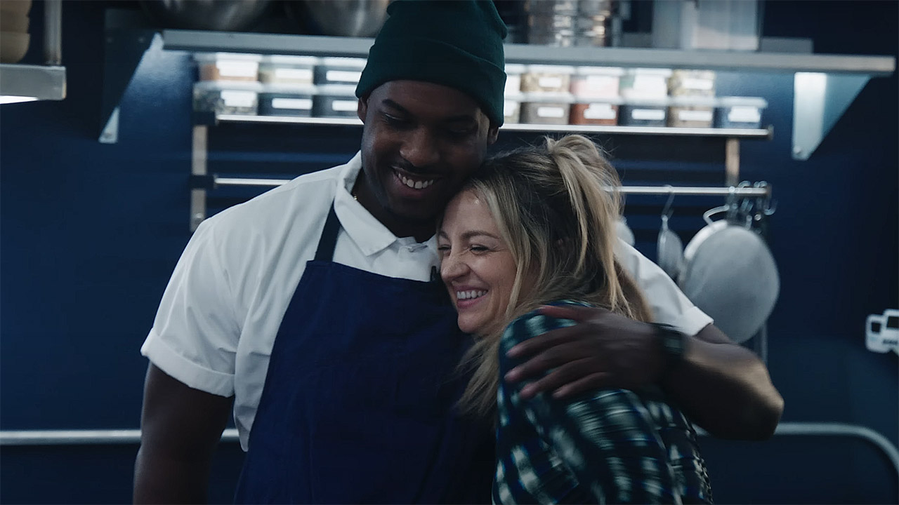 Marcus and Natalie smiling and hugging in The Bear season 4
