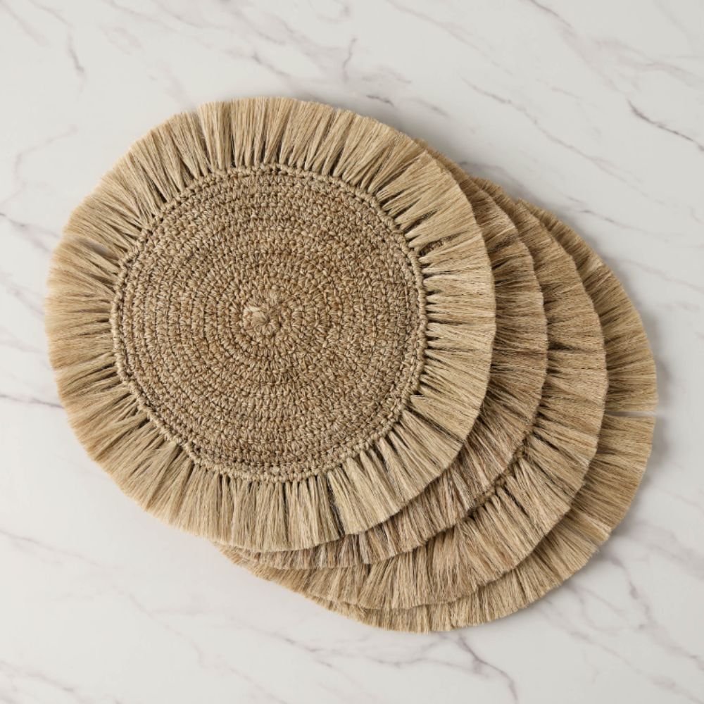 Set of four natural fringed placemats