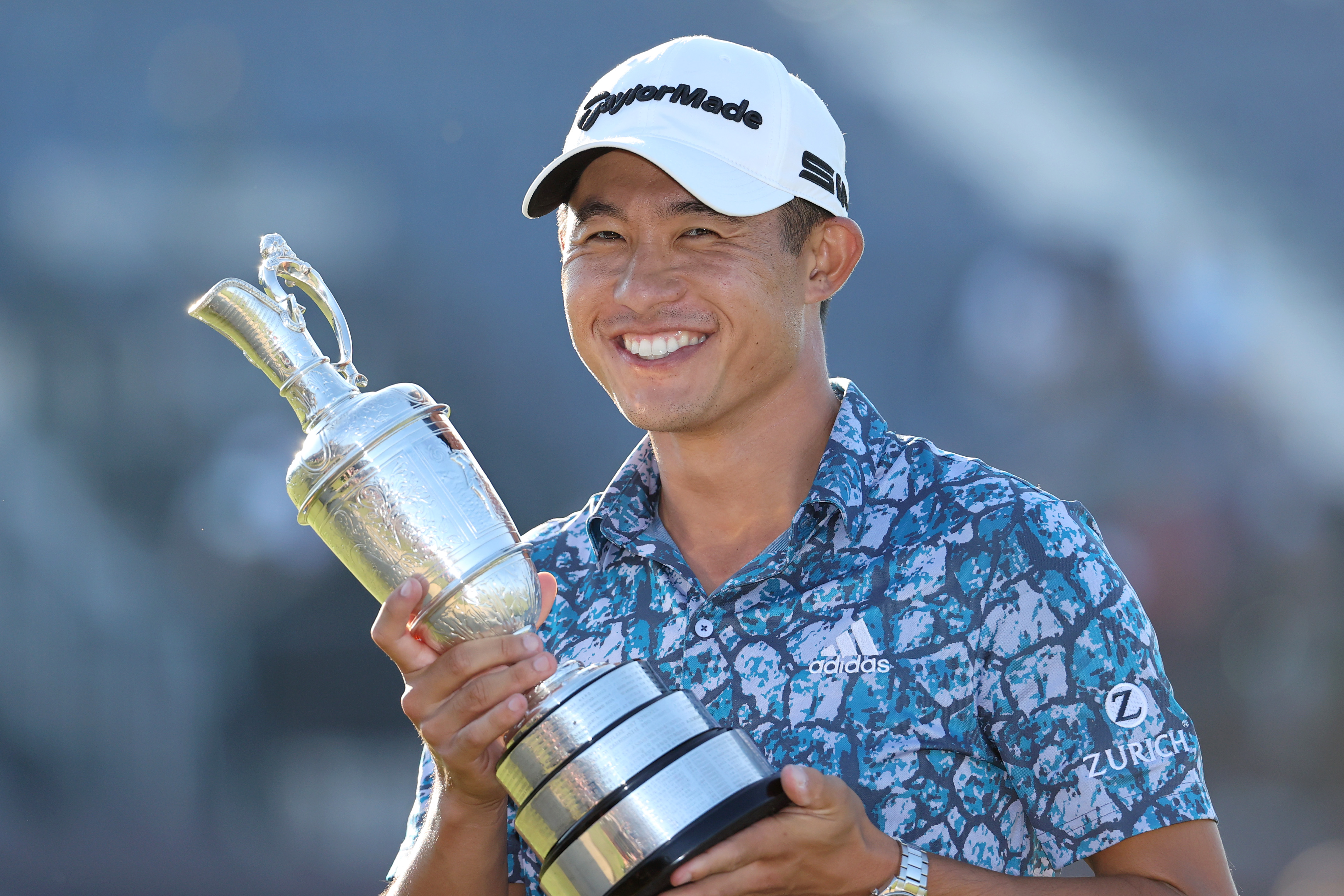 Collin Morikawa poses with the Claret Jug on the 18th hole during Day Four of The 149th Open at Royal St George&amp;rsquo;s Golf Club.