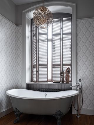 A bathroom with shutters