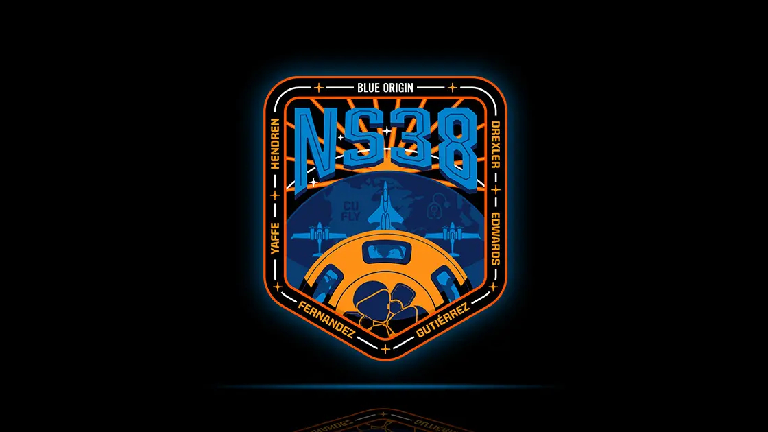 black, orange and blue themed mission patch