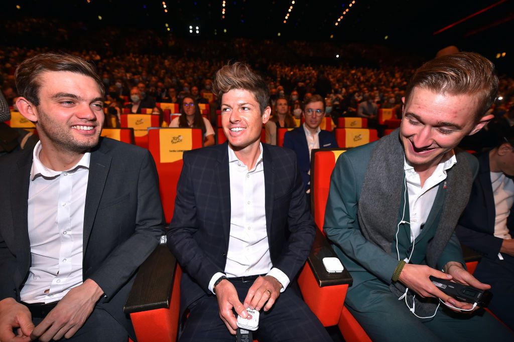 PARIS FRANCE OCTOBER 14 LR Kasper Asgreen of Denmark and Team Deceuninck QuickStep Jakob Fuglsang of Denmark and Team Astana Premier Tech and Mikkel Bjerg of Denmark and UAE Team Emirates during the 109th Tour de France 2022 And 1st Tour de France Femmes 2022 Route Presentation TDF2022 LeTour on October 14 2021 in Paris France Photo by Luc ClaessenGetty Images