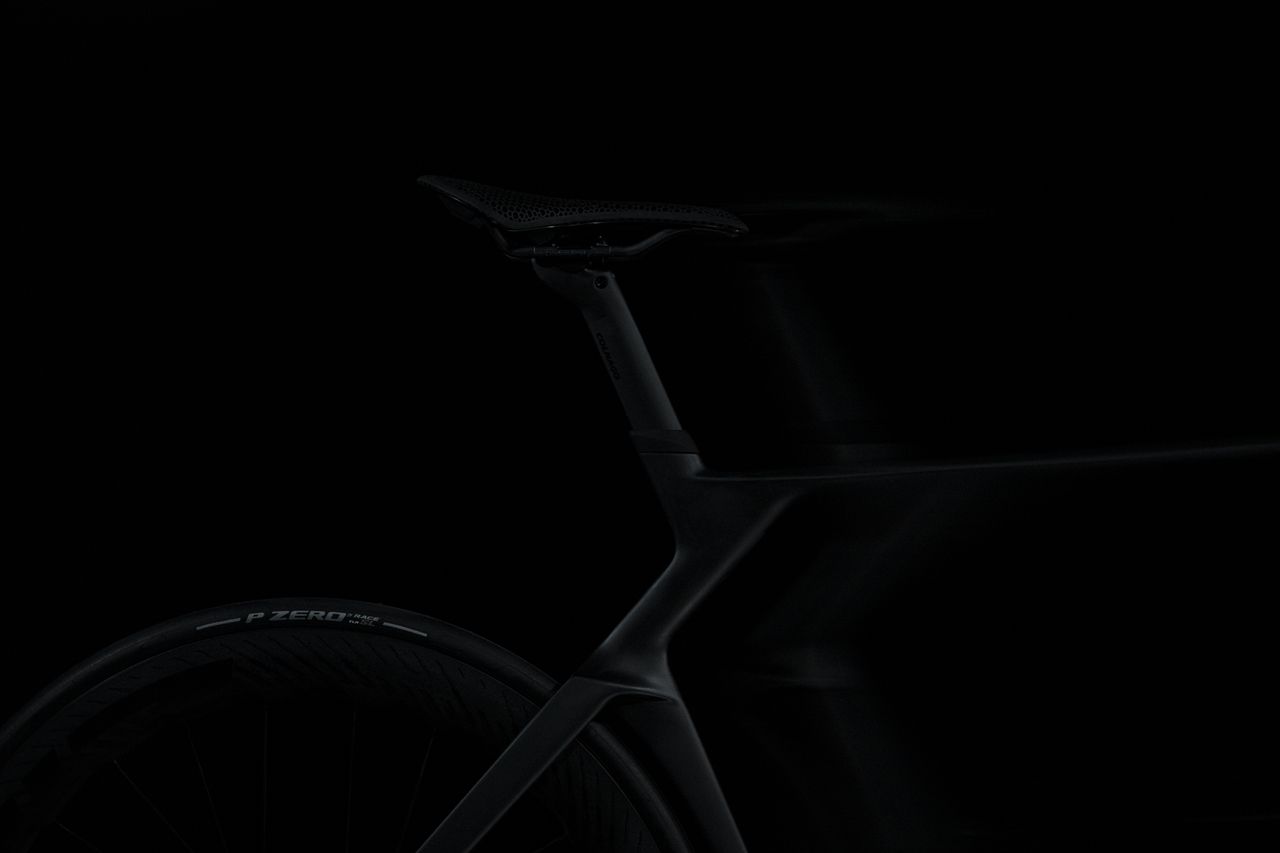 shadowy shots of a black Colnago bike on a black background
