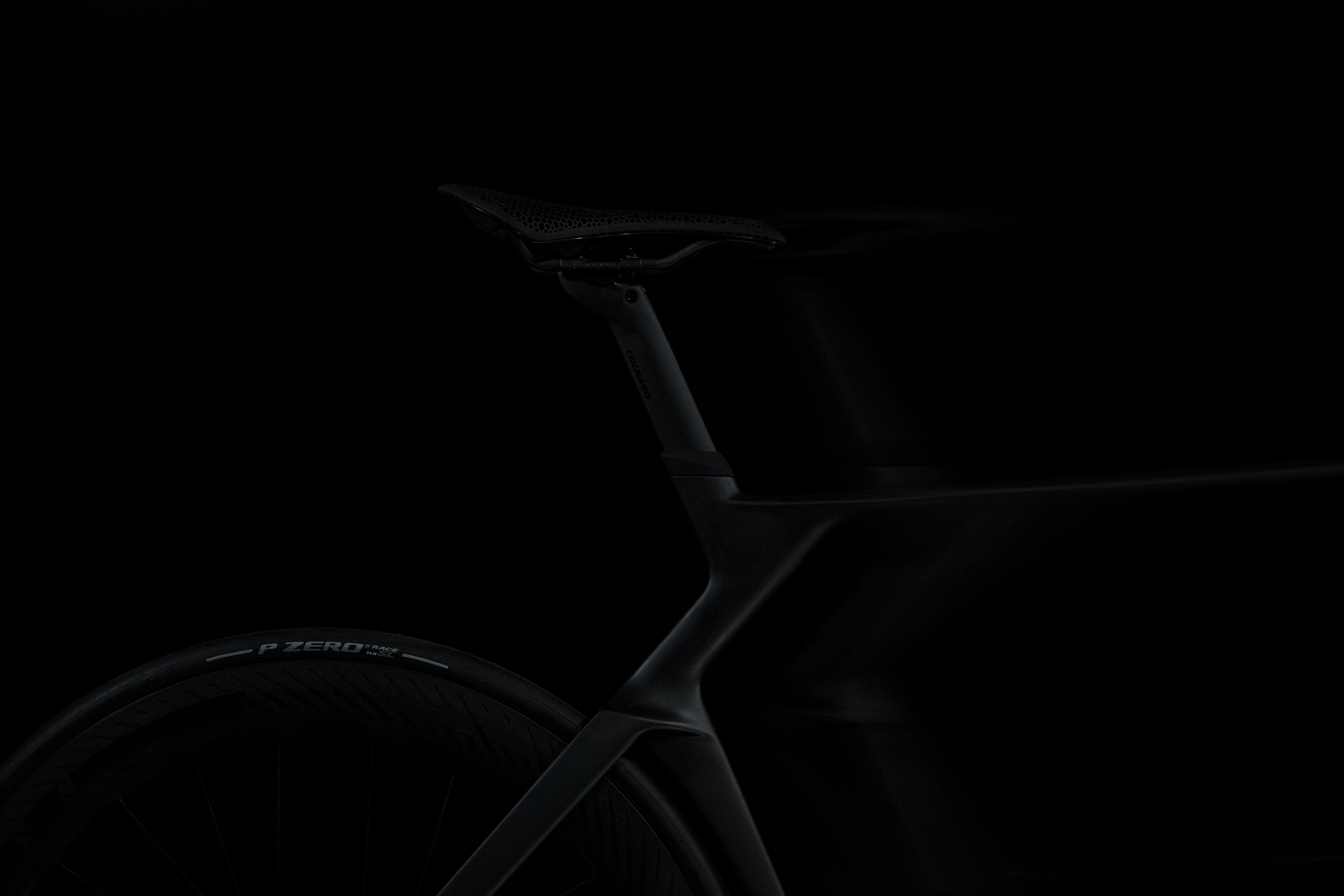 shadowy shots of a black Colnago bike on a black background