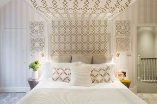 neutral bedroom with fabric panel above the bed