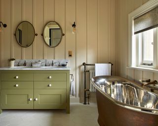bathroom colors in yellow and green with brass bath