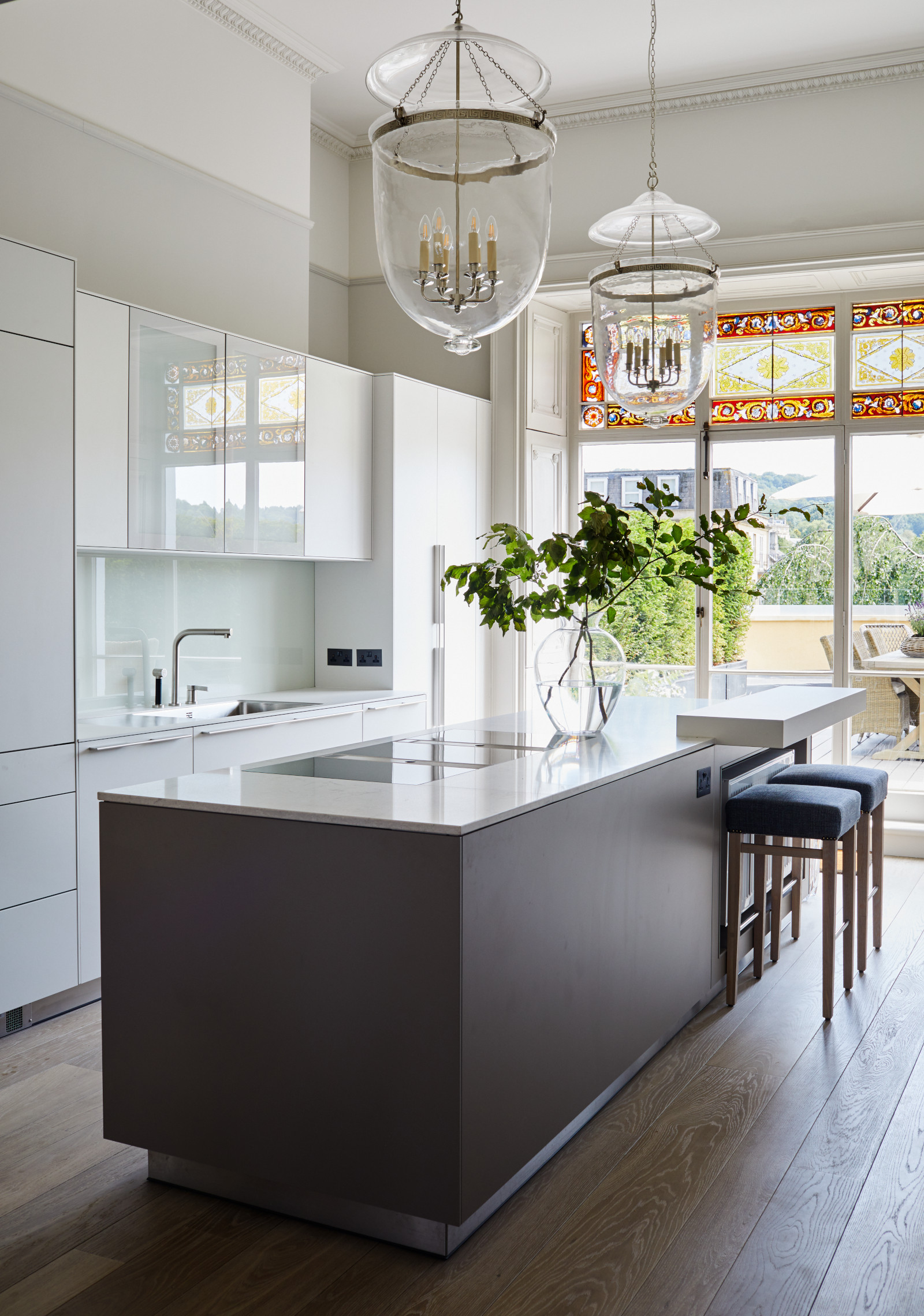 Kitchen with large kitchen island and doors to garden