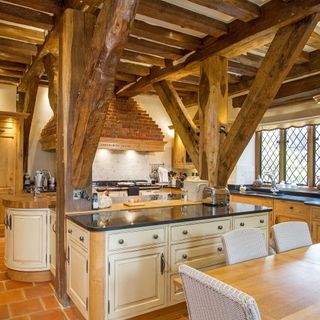kitchen with wooden beams and terracotta flooring