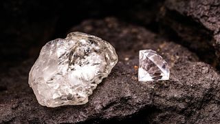Diamonds are formed deep within the mantle. In this image, a rough uncut diamond is pictured next to a cut and polished diamond.