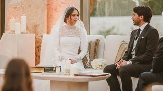 King of Jordan Abdullah II (L), attends The Royal Wedding of Princess Iman Bint Abdullah II (C) and Jameel Alexander Thermiotis (2nd R) on March 12, 2023 in Amman, Jordan.