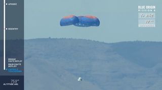The crew capsule of Blue Origin's New Shepard 2.0 suborbital spacecraft descends to Earth under parachutes after a successful test flight in West Texas on April 29, 2018.