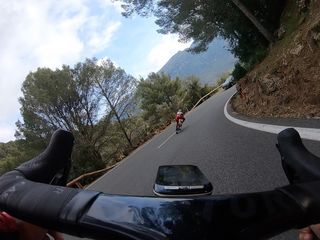 Marco Mathis passes a car on a descent while training