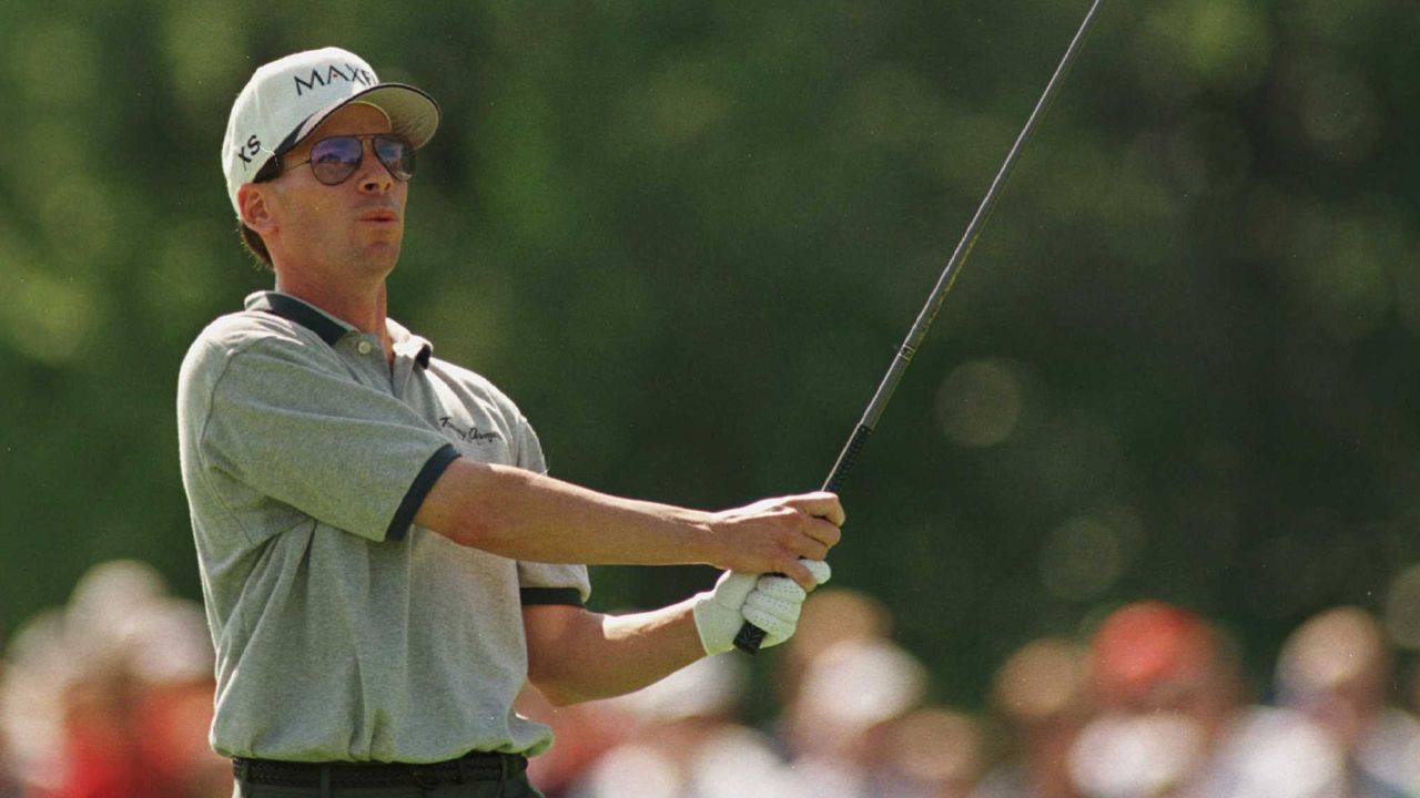 John Huston plays an iron shot at the 1996 Memorial Tournament