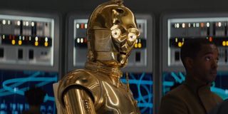 Star Wars: The Rise of Skywalker C3PO sitting with red eyes on a repair table