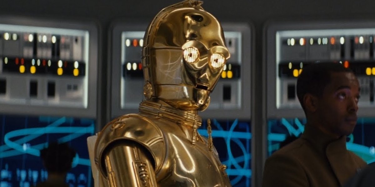 Star Wars: The Rise of Skywalker C3PO sitting with red eyes on a repair table