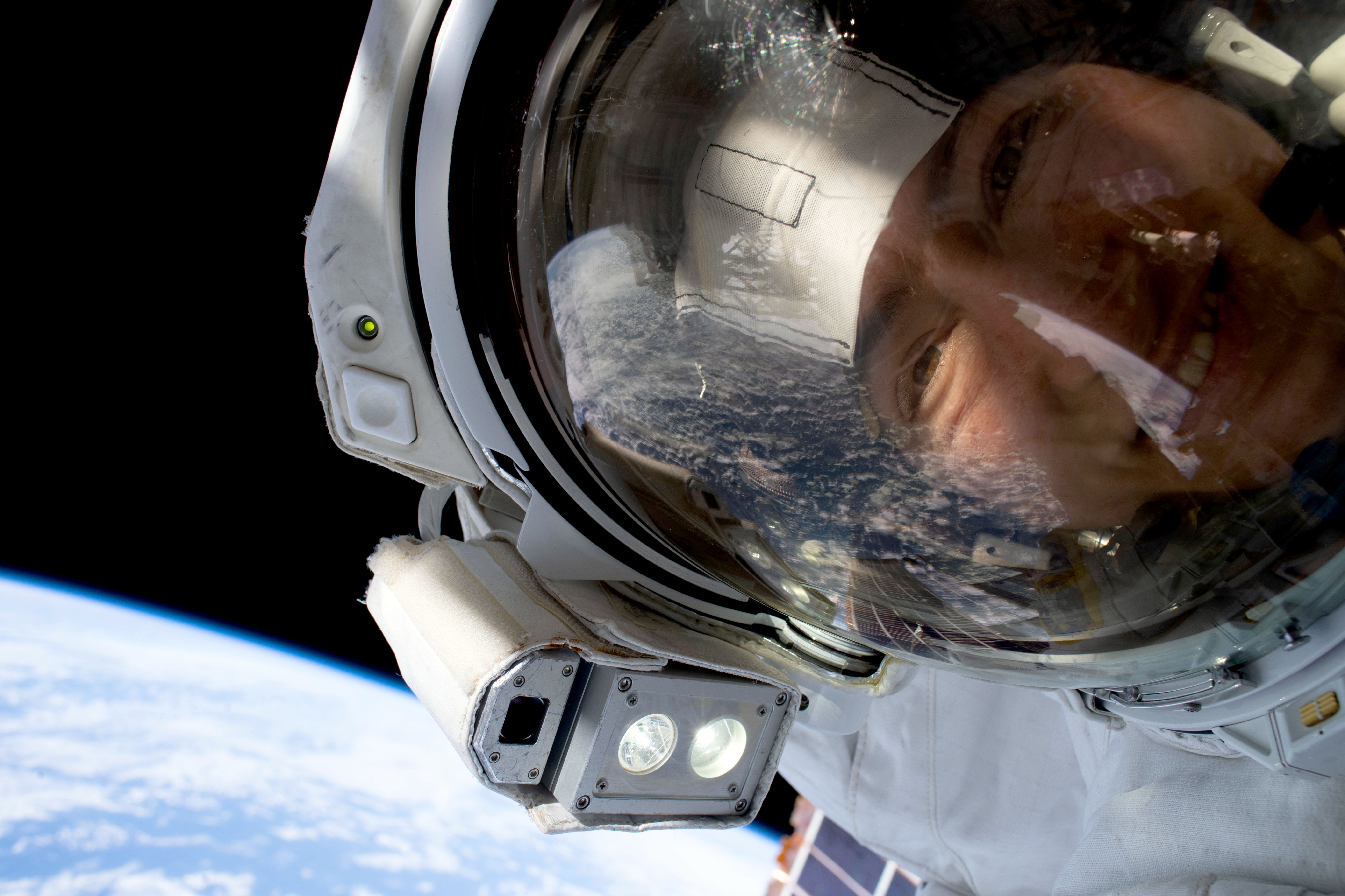 NASA astronaut Christina Koch pauses as she helps replace equipment on the International Space Station. She and her fellow astronauts faced a suite of health effects while in space.