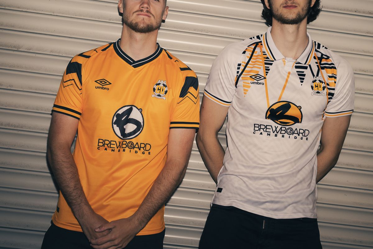 Cambridge United's home and away Umbro shirts from the 2023-24 season