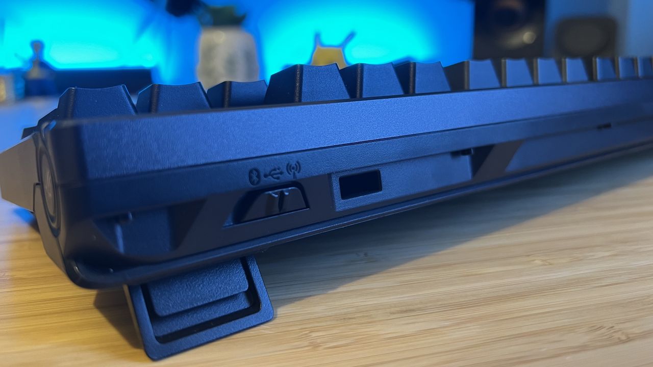 Close up on wireless connection toggle on Asus ROG Azoth 96 HE gaming keyboard