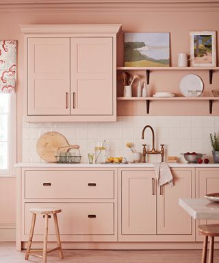 Pink kitchen cabinets, shelves and base cabinets, white backsplash tiles