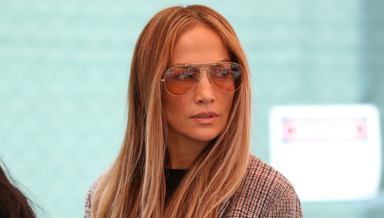 Jennifer Lopez in los angeles wearing a plaid blazer jeans and a rare birkin bag