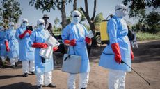 Operators in PPE gear helping with Ebola outbreak