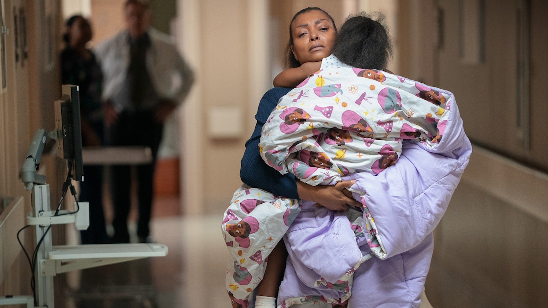 Taraji P Henson holding a child in Straw