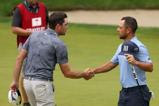 Keegan Bradley and Xander Schauffele shaking hands at the 2023 Travelers Championship