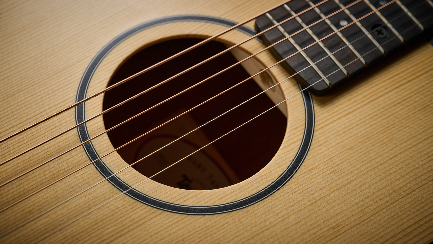 Close up of the soundhole of the Taylor BT1e Baby Taylor 3/4 acoustic guitar