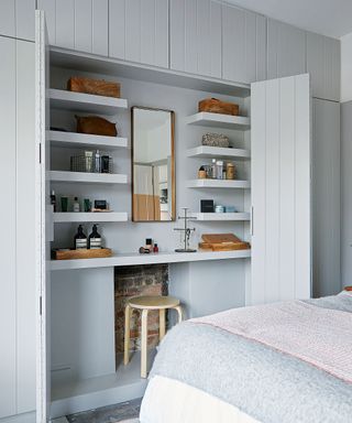 Bedroom with vanity area built into wardrobe space