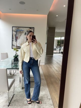 Anna LaPlaca wearing Alex Mill jeans and a Tory Burch jacket