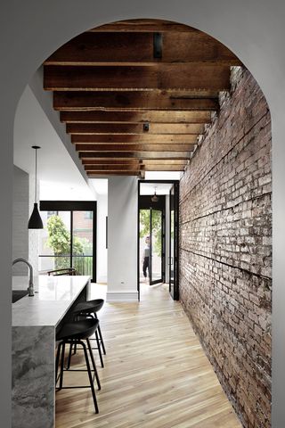arched passageway leading into a kitchen
