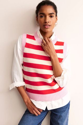 woman wearing red and pink striped knitted vest