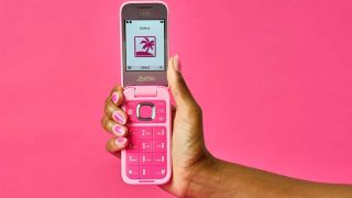 The Barbie flip phone open in hand, displaying the Gallery app.