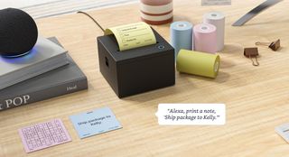 An Amazon sticky note printer on a desk